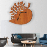 Wooden leaf-shaped wall clock with intricate cut-out design on a white living room wall